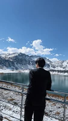 Man Overlooking Mountains wallpaper thumbnail